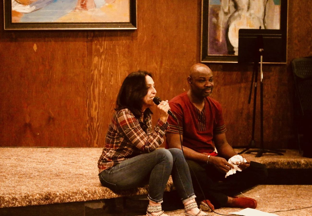 Two artists performing together at The Mic Sessions