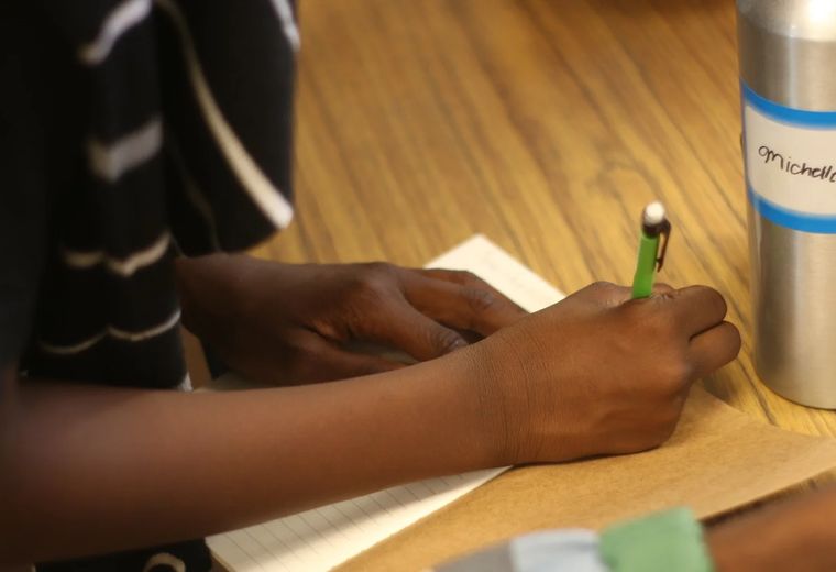 Participants writing during a HeArt Session